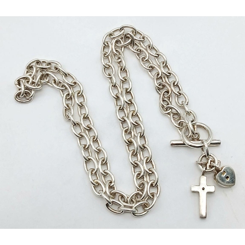 1083 - A Sterling Silver Chain with T-Bar Clasp and Cross Charm. 36cm. 14.75g