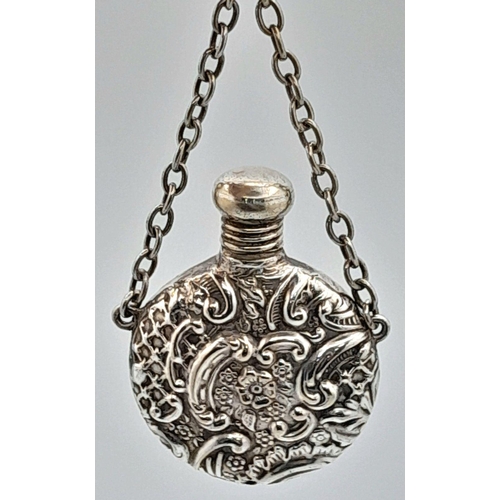 1598 - A vintage metal snuff box with floral motif engravings (include chain). Please see photos for detail... 