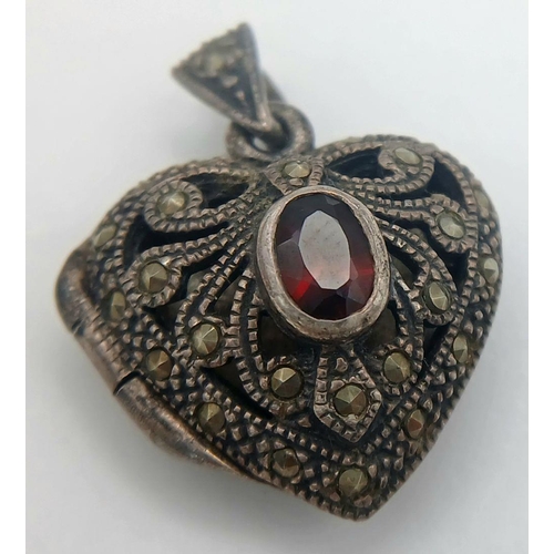 1664 - A Vintage Silver, Garnet and Marcasite Heart Pendant. 2.5cm.