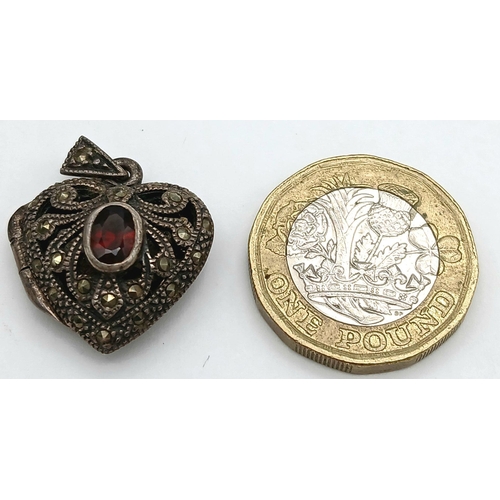 1664 - A Vintage Silver, Garnet and Marcasite Heart Pendant. 2.5cm.