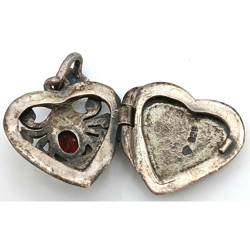 1664 - A Vintage Silver, Garnet and Marcasite Heart Pendant. 2.5cm.