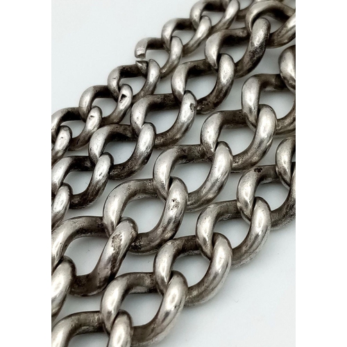 656 - A Silver Double Albert Watch Chain with Fob and T-bar. 40cm in length and 63.2g total weight.