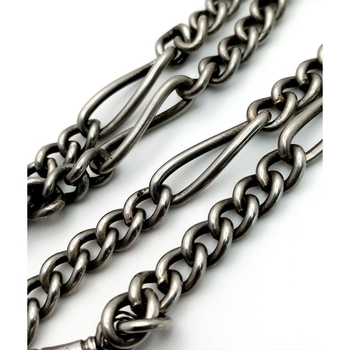 684 - A double Albert watch chain featuring a silver clip and fob with T-bar, attached to a white metal ch... 