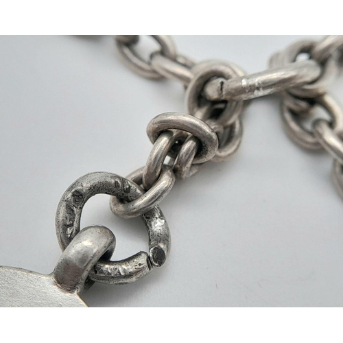 832 - A silver double Albert watch chain with fob and T-bar. 40.5cm in length and 28.6g total weight.