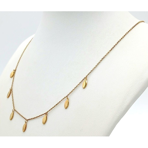 884 - A gilt silver necklace with delicate drop accents. approx 42.4cm in length , 3.4g total weight.