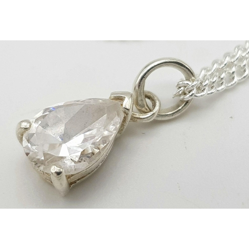 891 - A sterling silver necklace featuring a clear stone teardrop pendant. 50.1cm in length , 1.8cm x 0.6c... 