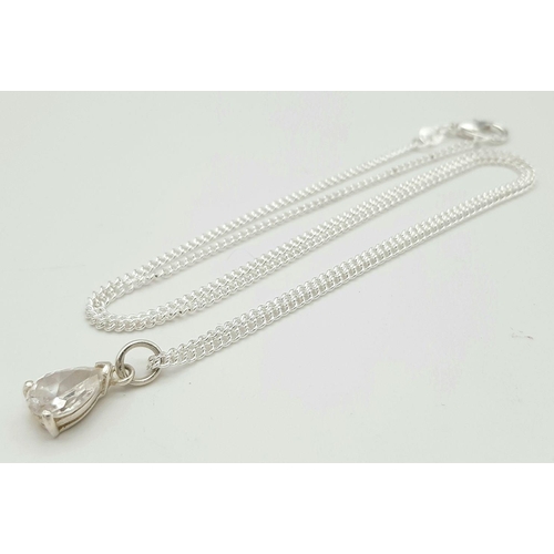 891 - A sterling silver necklace featuring a clear stone teardrop pendant. 50.1cm in length , 1.8cm x 0.6c... 