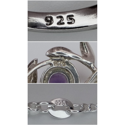 1138 - A matching set featuring a 925 sterling silver ring and pendant necklace. The pendant showcases a sw... 