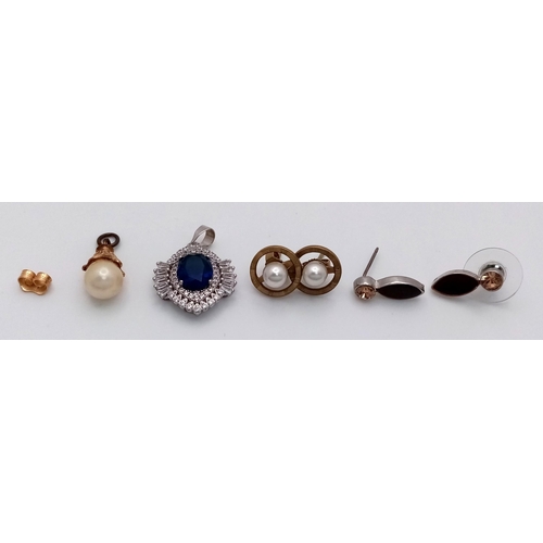 1536 - A collection of assorted pendants, including silver pieces and various designs.