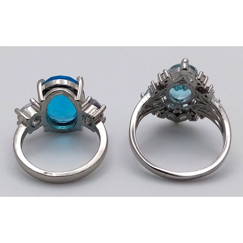 814 - Two sterling silver 925 rings, each showcasing striking blue gemstones: one features a bold oval-cut... 