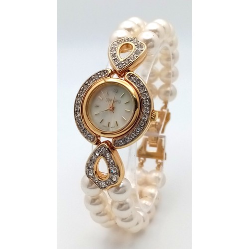 168 - A very collectible, JOAN RIVERS glamorous watch with cubic zirconia and a double shell pearl bracele... 