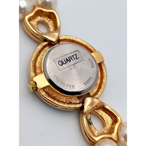 168 - A very collectible, JOAN RIVERS glamorous watch with cubic zirconia and a double shell pearl bracele... 