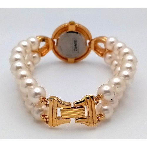 168 - A very collectible, JOAN RIVERS glamorous watch with cubic zirconia and a double shell pearl bracele... 