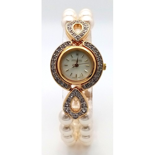 168 - A very collectible, JOAN RIVERS glamorous watch with cubic zirconia and a double shell pearl bracele... 