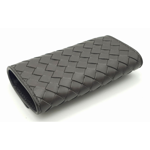 1597 - A BOTTEGA VENETA WOVEN LEATHER KEY CASE, AS NEW WITH DUST COVER .