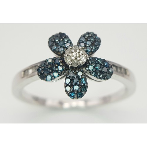 1041 - A Sterling Silver Blue and Clear Diamond Set Flower Ring Size S. The Ring Measures 1.2cm Wide at the... 