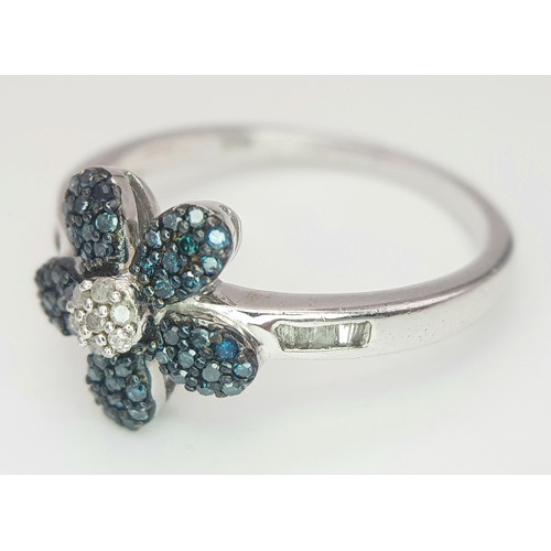 1041 - A Sterling Silver Blue and Clear Diamond Set Flower Ring Size S. The Ring Measures 1.2cm Wide at the... 