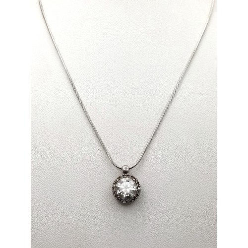 1576 - A Cubic Zirconia Pendant Set on 925 Silver with a Silver Snake Chain Necklace. 1.5cm pendant, 41cm c... 