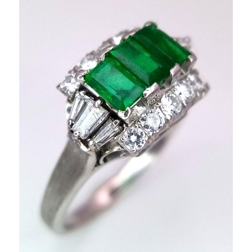 1150 - A PLATINUM EMERALD AND DIAMOND RING WITH 3 QUALITY EMERALDS FLANKED BY DIAMONDS AND DIAMOND BAGUETTE... 