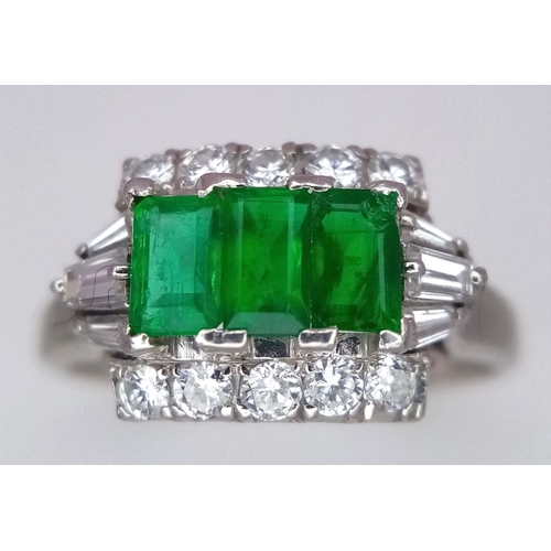 1150 - A PLATINUM EMERALD AND DIAMOND RING WITH 3 QUALITY EMERALDS FLANKED BY DIAMONDS AND DIAMOND BAGUETTE... 