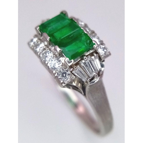 1150 - A PLATINUM EMERALD AND DIAMOND RING WITH 3 QUALITY EMERALDS FLANKED BY DIAMONDS AND DIAMOND BAGUETTE... 