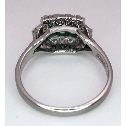 1150 - A PLATINUM EMERALD AND DIAMOND RING WITH 3 QUALITY EMERALDS FLANKED BY DIAMONDS AND DIAMOND BAGUETTE... 