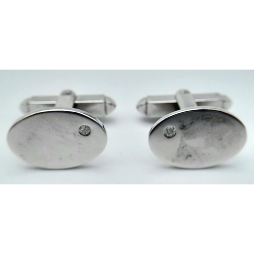 1383 - A Pair of 9K White Gold Diamond Set Cufflinks. 11.5g total weight.