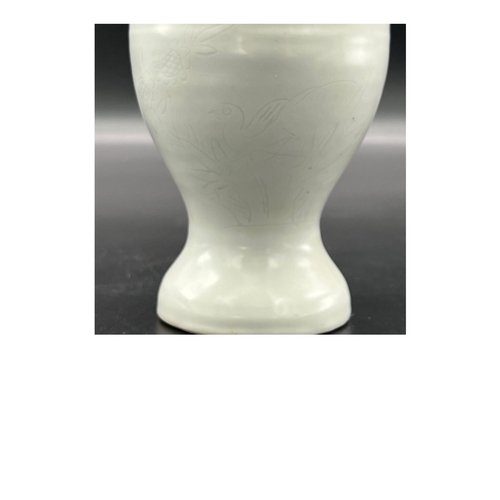 882 - A “sweet white” glazed two-handled vase with flower and bird pattern, Late Ming Dynasty. Minor chip ... 