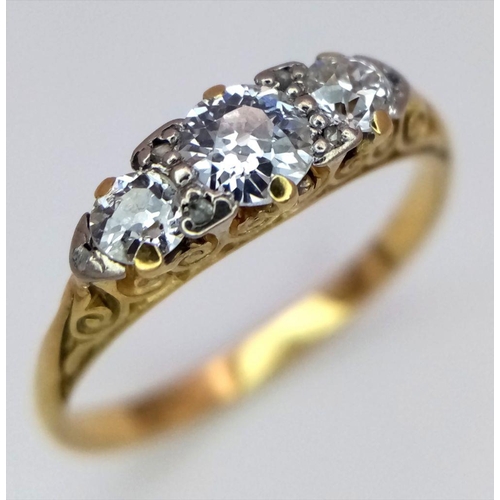 101 - A Beautiful 18K Yellow Gold Three Stone Diamond Ring. 0.55ctw of brilliant round cut diamonds in a s... 