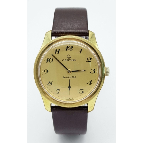 55 - A Vintage Bristol Certina 228 Gents Watch. Brown leather strap. Gilded case - 35mm. Gold tone dial w... 