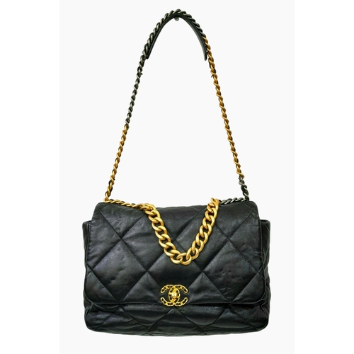 69 - A Large Chanel Quilted Black Leather Hand/Shoulder bag. Gold tone hardware. Outer pocket. Hand and s... 