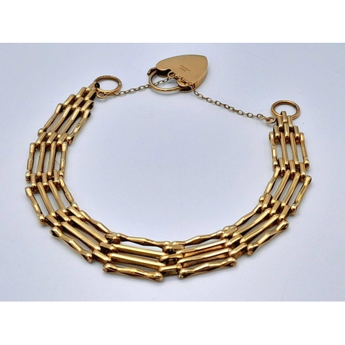 115 - A 9K Yellow Gold Gate Bracelet with Heart Clasp and Safety Chain. 16cm. 11.75g weight.