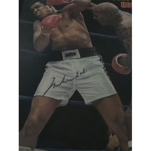 121 - A Signed Muhammad Ali and Ernie Shavers 1977 Sports Illustrated Framed Magazine. Titled: Ali's Despe... 