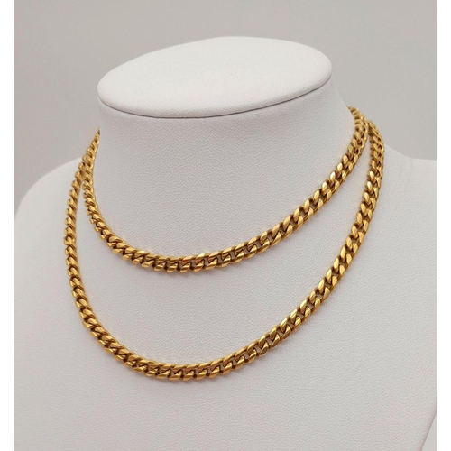 134 - An 18K Yellow Gold Curb Link Chain. 60cm. 51.9g weight.