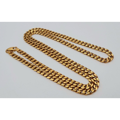 134 - An 18K Yellow Gold Curb Link Chain. 60cm. 51.9g weight.