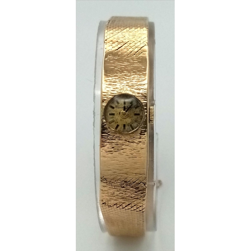 143 - A Vintage Bueche Girod 9K Gold Ladies Watch. 9k gold bracelet and case - 11g. Patinaed gilded dial. ... 