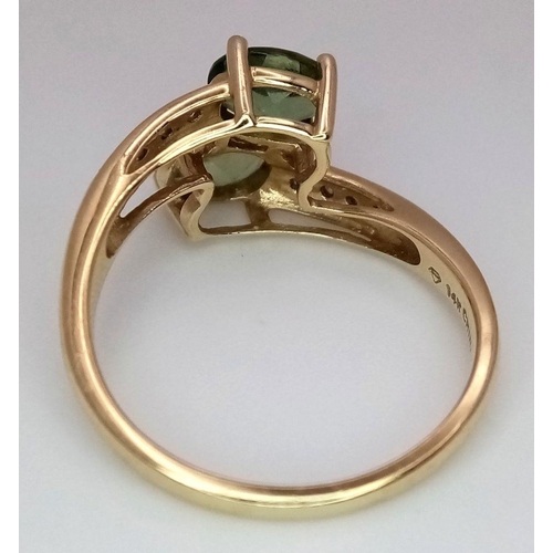 149 - A 14K Yellow Gold Diamond and Peridot Crossover Ring. Size P 1/2. 3.6g total weight.