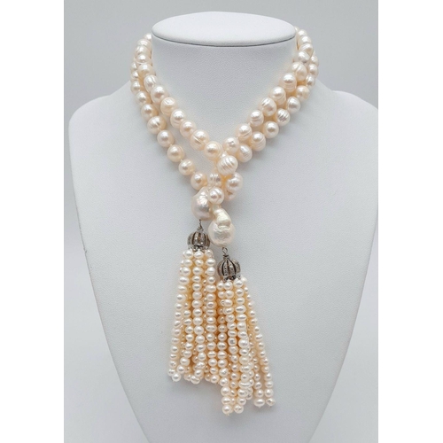 150 - A fabulous pearl necklace with two pearl tassels that can be worn in a number of ways. All natural c... 