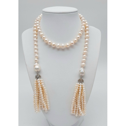 150 - A fabulous pearl necklace with two pearl tassels that can be worn in a number of ways. All natural c... 