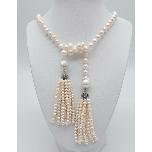 150 - A fabulous pearl necklace with two pearl tassels that can be worn in a number of ways. All natural c... 