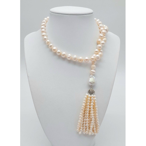 150 - A fabulous pearl necklace with two pearl tassels that can be worn in a number of ways. All natural c... 