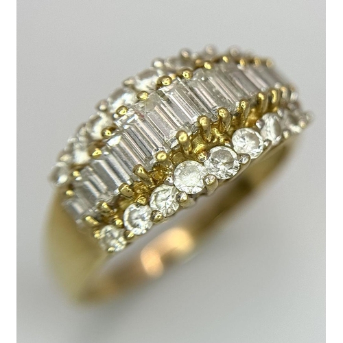 16 - An 18K Yellow Gold Three Row Diamond Ring. An extravagant central row of baguette cut diamonds with ... 