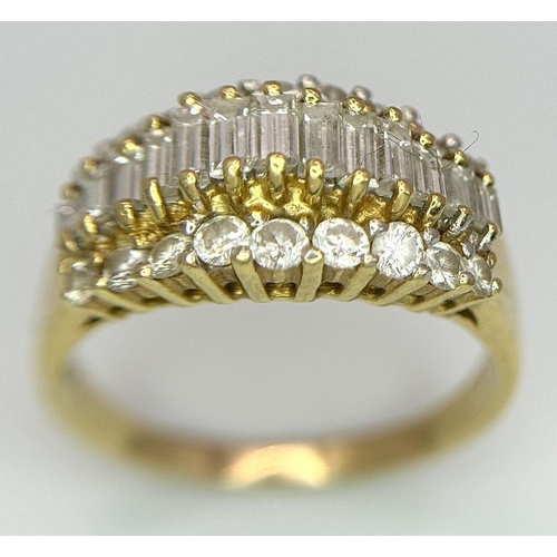 16 - An 18K Yellow Gold Three Row Diamond Ring. An extravagant central row of baguette cut diamonds with ... 