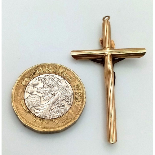 176 - A 9K Yellow Gold Crucifix Pendant. 5cm x 2.5cm. 1.4g.