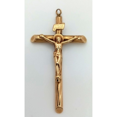 176 - A 9K Yellow Gold Crucifix Pendant. 5cm x 2.5cm. 1.4g.