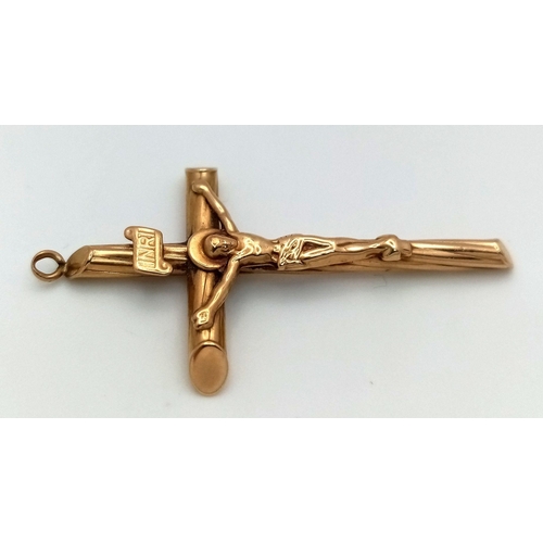 176 - A 9K Yellow Gold Crucifix Pendant. 5cm x 2.5cm. 1.4g.