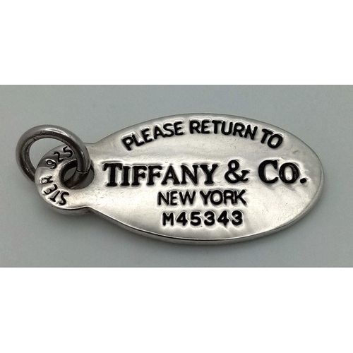 204 - A Sterling Silver Tiffany and Co. Pendant or Charm. Oval shape. 4.5cm. 14g