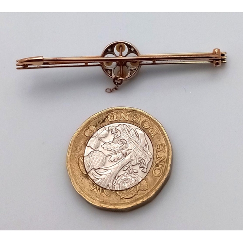 22 - An Antique 15K Gold and Platinum Bar Brooch. Seed pearl and diamond decoration. 5cm. 3.37g total wei... 