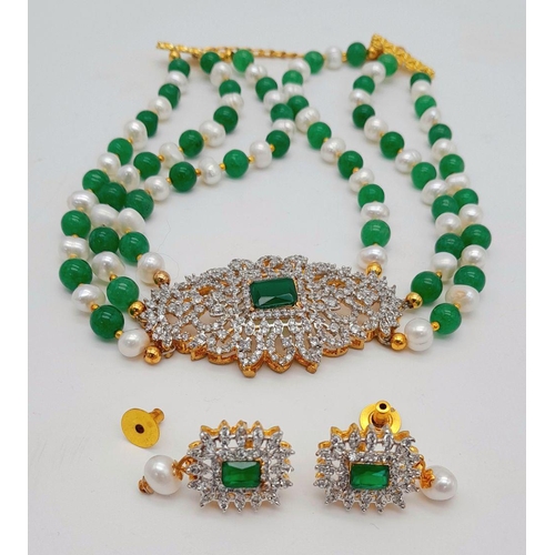 255 - A very classy choker necklace with alternating natural white pearls and green jade and a very glamor... 