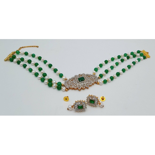 255 - A very classy choker necklace with alternating natural white pearls and green jade and a very glamor... 